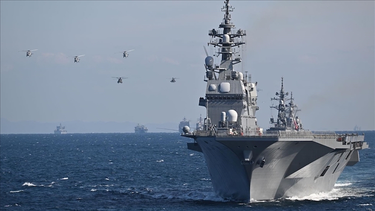 Photo: A Twitter shared photo by Japan Maritime Self-Defense Force of Japanese Self Defense Forces holding the International Fleet Review 2022 with the participation of naval vessels and aircraft from 13 countries. Credit: Anadolu Agency.